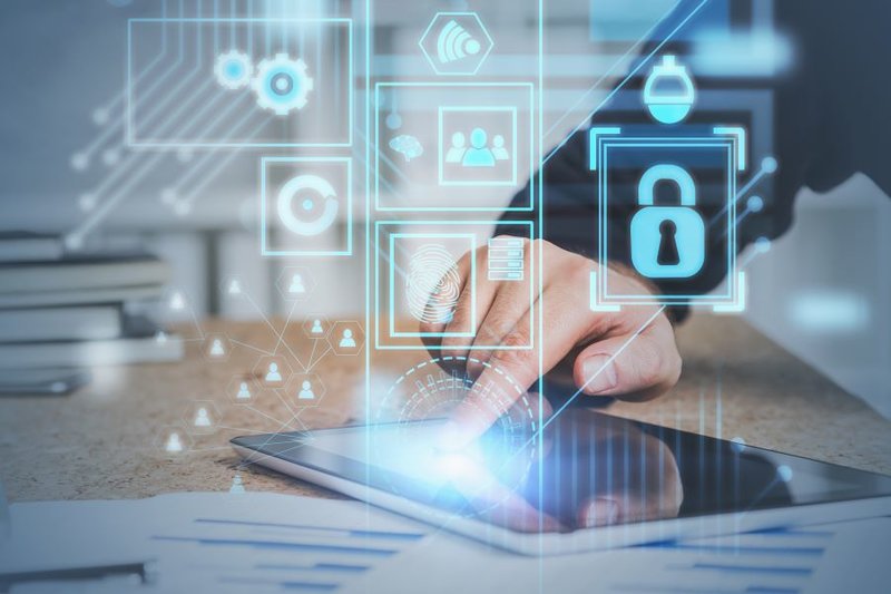 Cloud security - hand typing on tablet