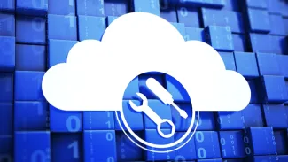 Pros and Cons of AWS native tools in managing cloud costs - pic of a cloud with a wrench and screwdriver anc code in the background